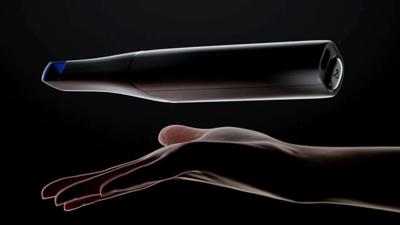 Arcscan intraoral scanner floating above an open hand, CGI